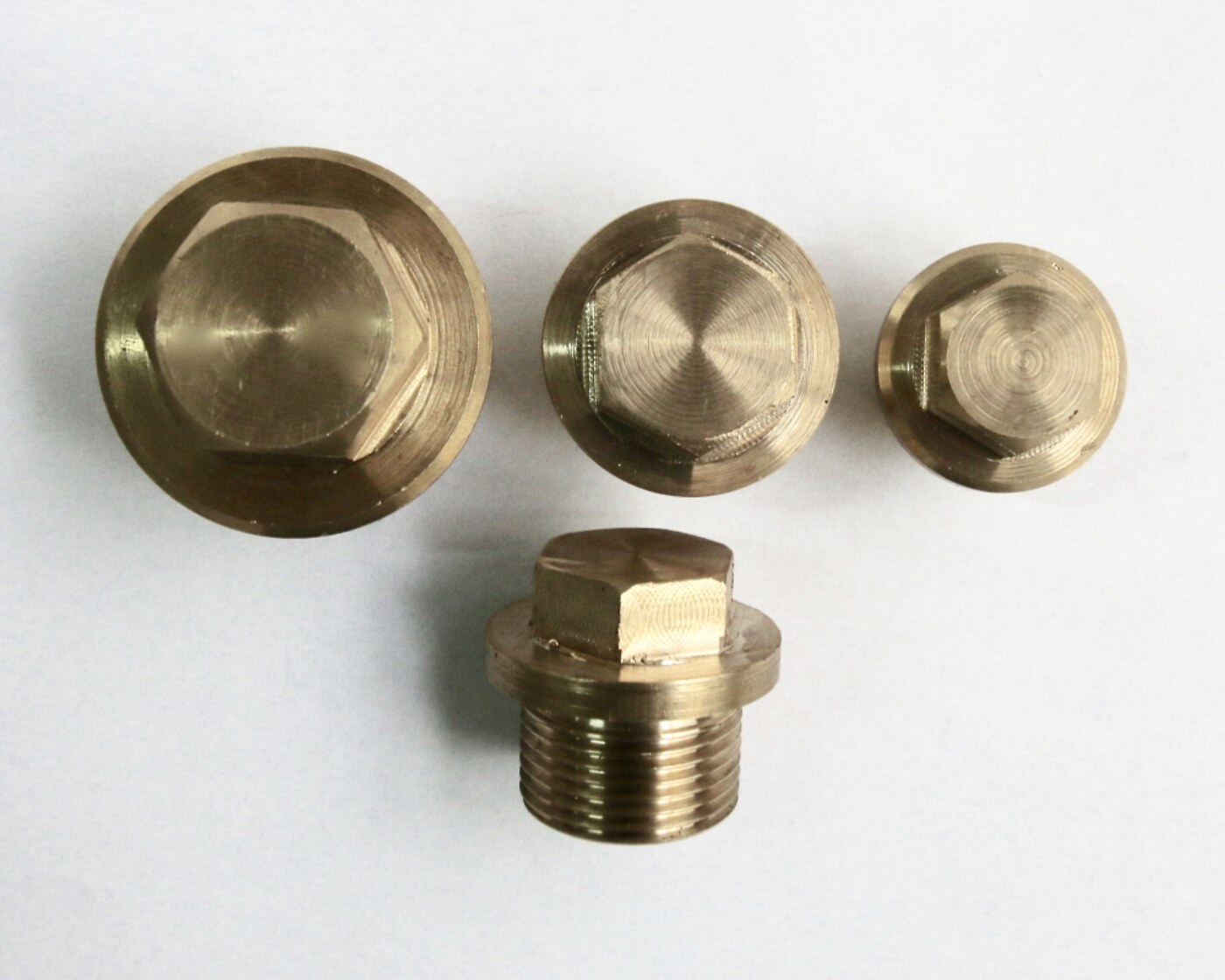 Machined bronze plugs and threaded fittings